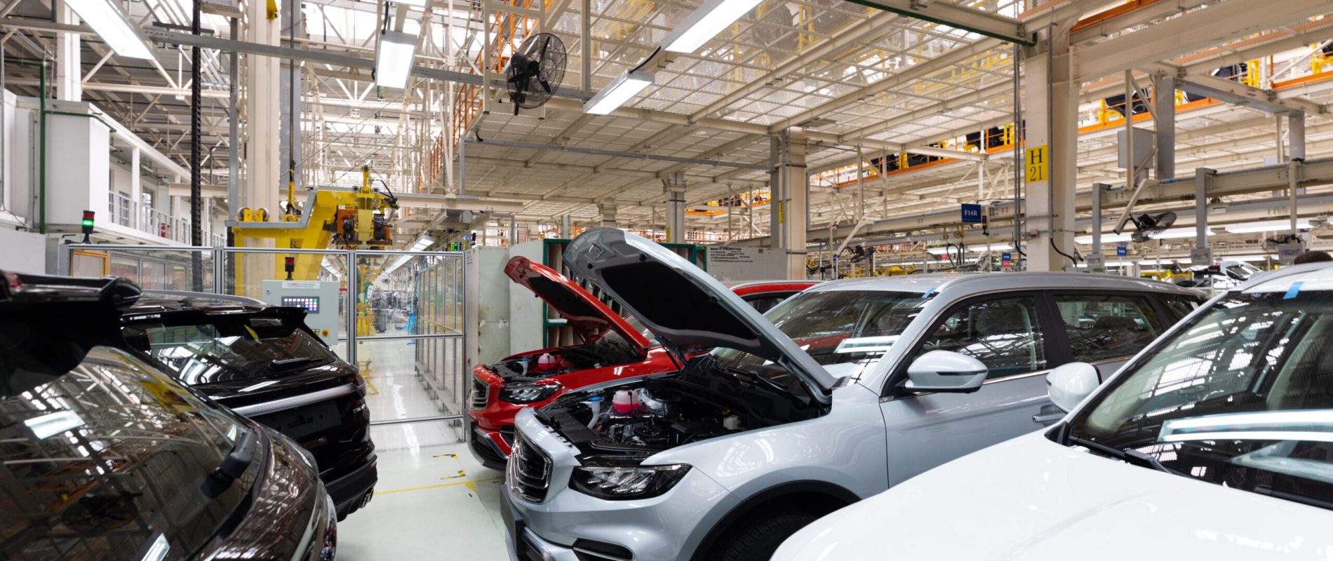 Modern car assembly plant. Auto industry. Interior of a high-tech factory, modern production of automobiles.