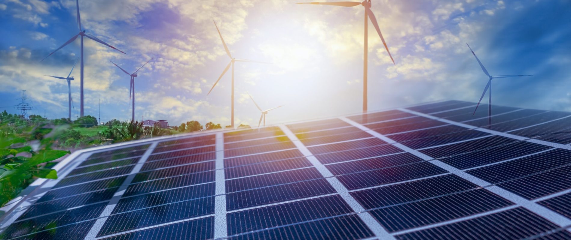 Solar panels and wind power stations. Renewable energy wind and solar generation. Defocused photo with soft focus.